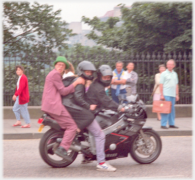 Entertainer jumped onto back of motorbike.