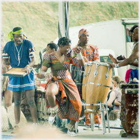 Woman dancing to drummer.