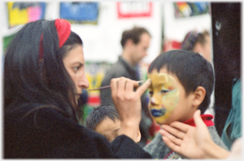 Boy's face being painted.