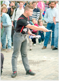 Man offering leaflet.