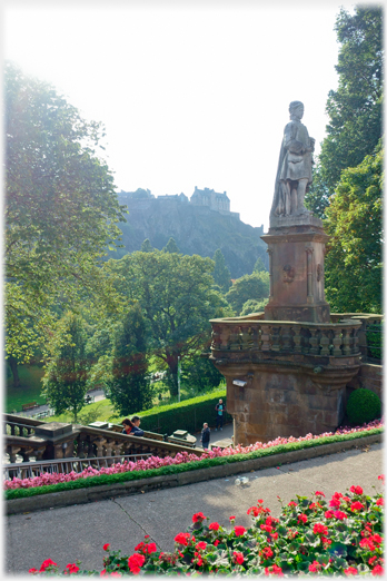 Statue with castle beyond.