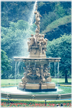 Gold coloured fountain in action.
