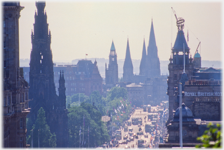 Long focal length lens view down Princes Street.