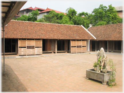 Courtyard of houses with tiled roofs.