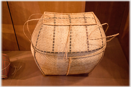 Woven lidded carrying basket.