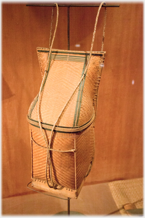 Vertical back basket with lid.