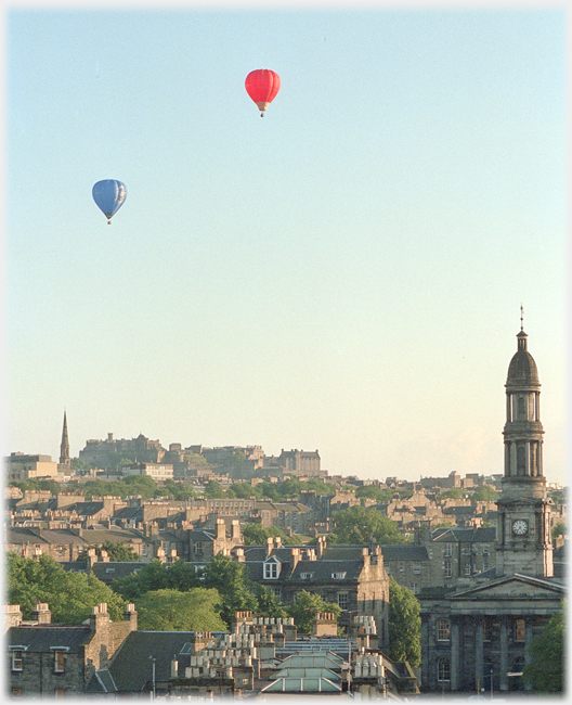 Two balloons above Edinburgh Castle.