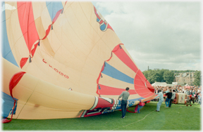 Well inflated balloon lying on the ground.