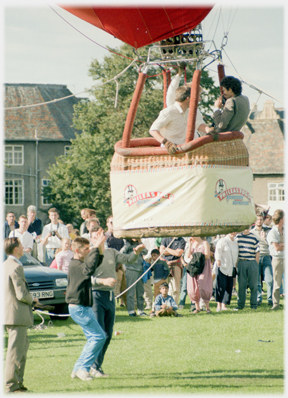 Balloon basket just off the ground.