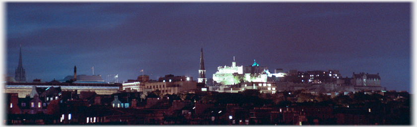 Castle and part of city in twilight.