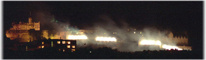 Waterfalls of white fireworks flowing over the Castle walls.