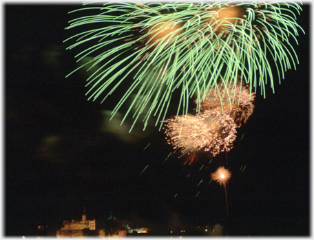 Green and bronze fire bursts above castle.