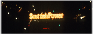 The sponsers of the Forth Rail Bridge in lights: Scottish Power.