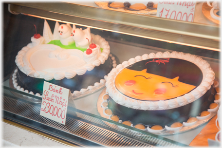 Cakes in a window.