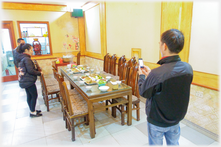 Chef photographing food.