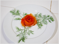A flower from carrot with leaves.