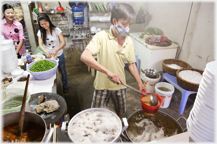 Dishing up in a busy kitchen.