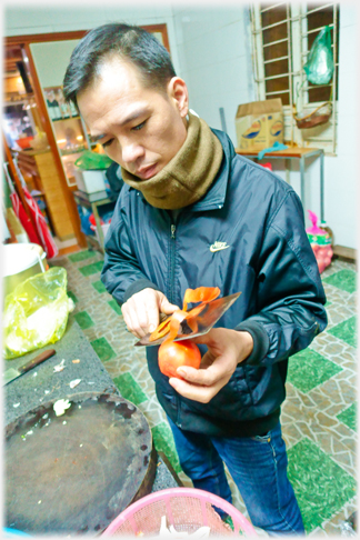 Peeling tomato.