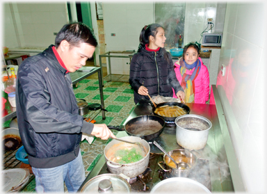 Two chefs cooking.