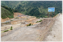 Scraped valley with diggers.