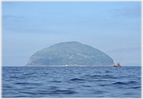 Sea island and fishing boat.