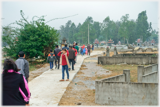 Families leaving the cemetry.