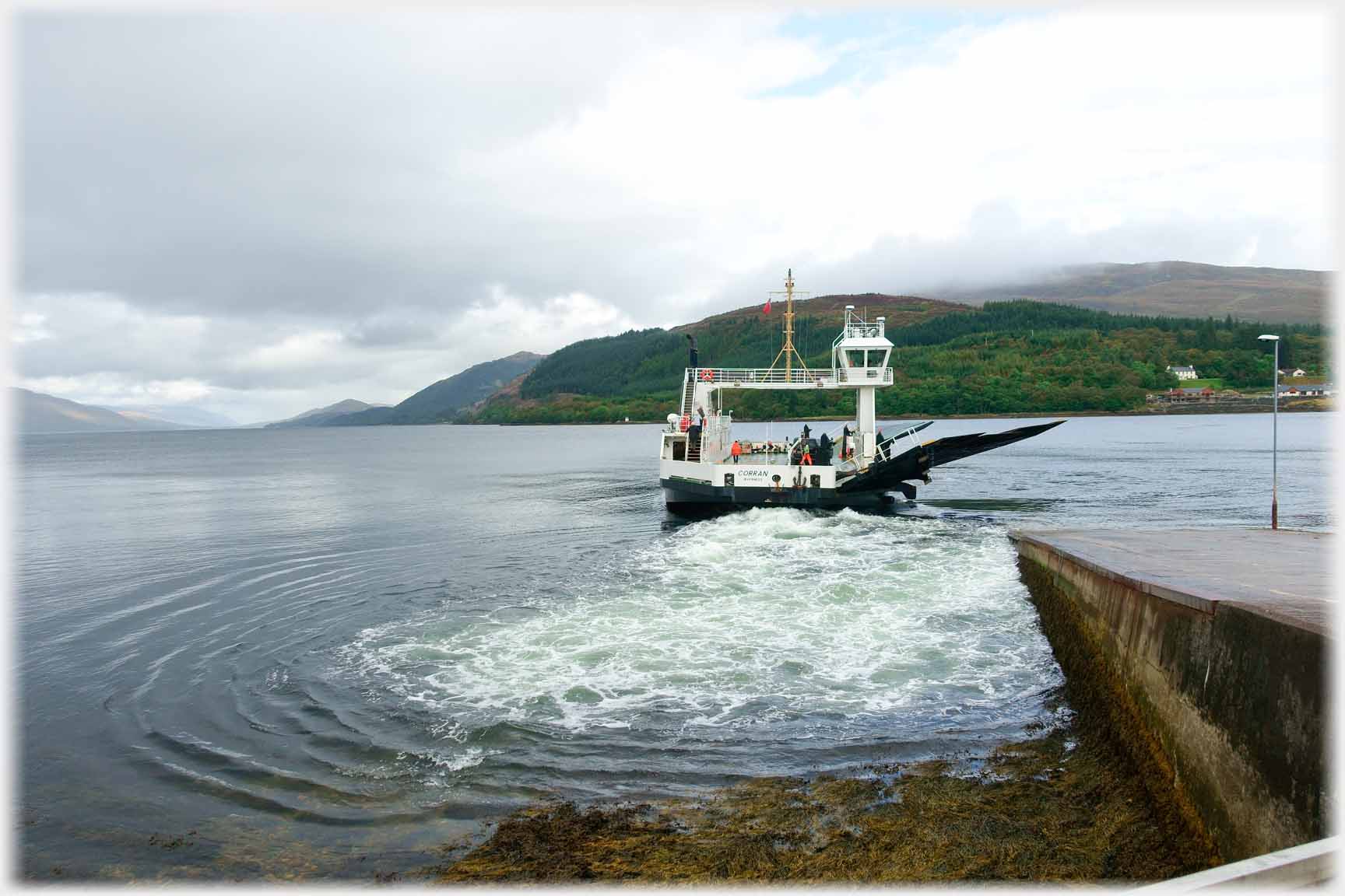 Ferry boat leaving pier.