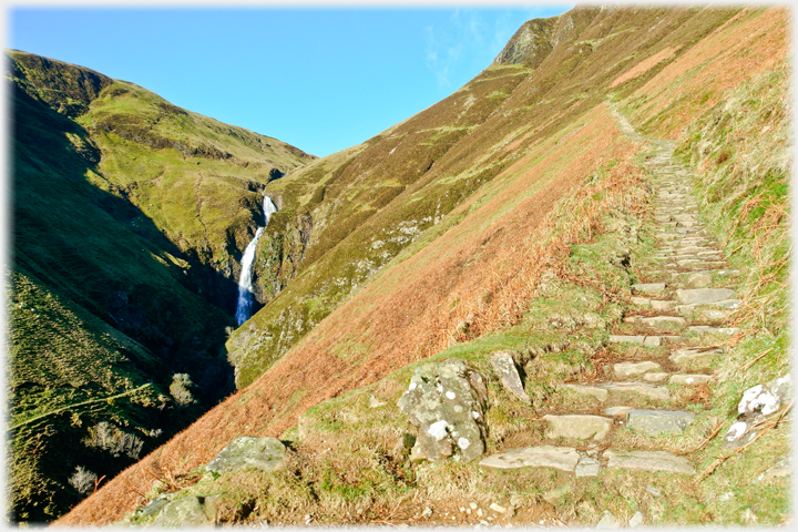 Steps on the hillside by the waterfall.