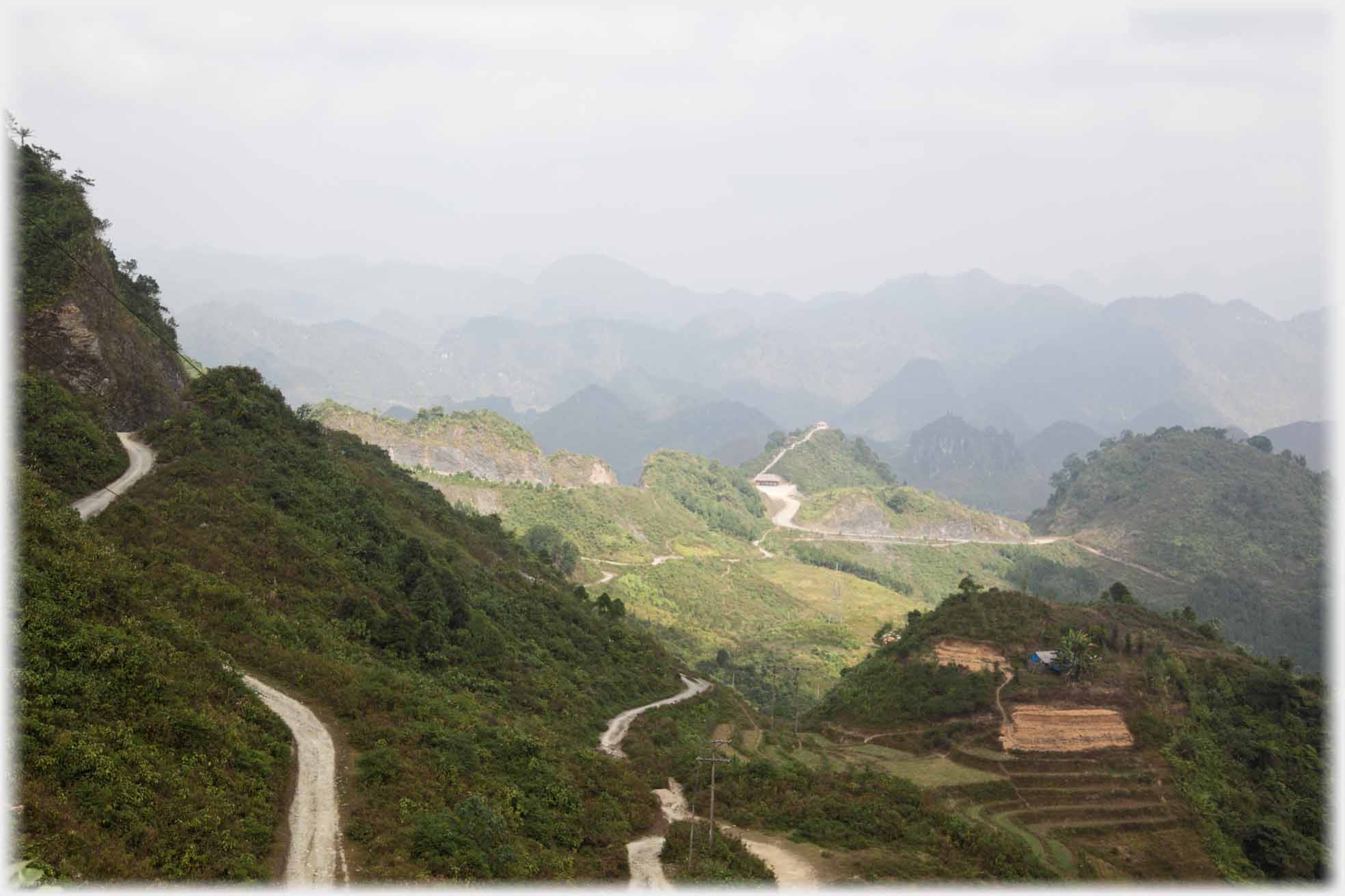 Sloping hills with number of roads winding across it.