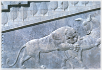 Bas relief of lion attacking a bull.