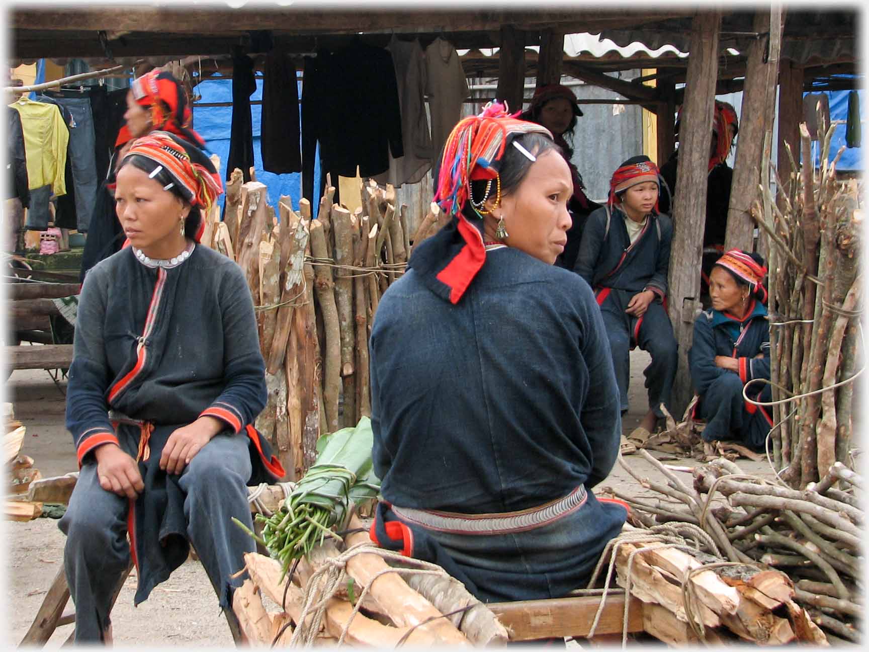 Two women sitting looking either way.