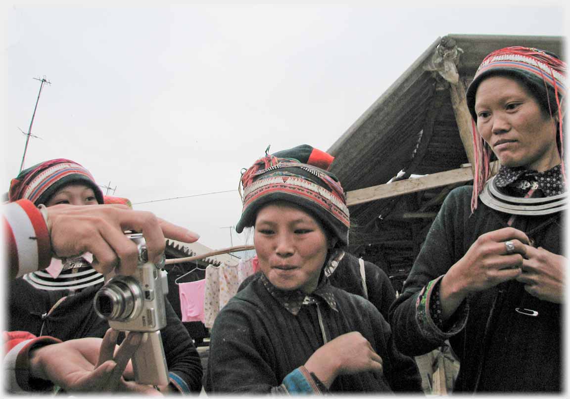 Two women looking at camera back.