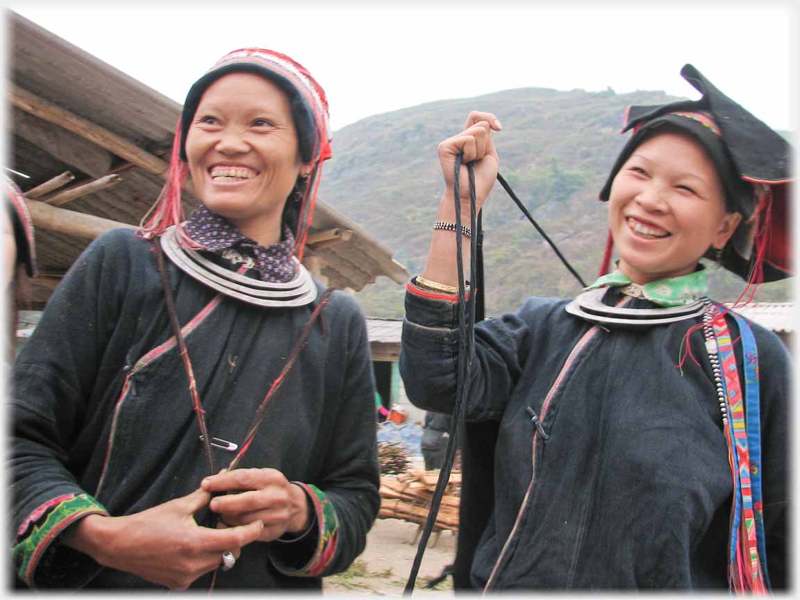 Two women laughing.