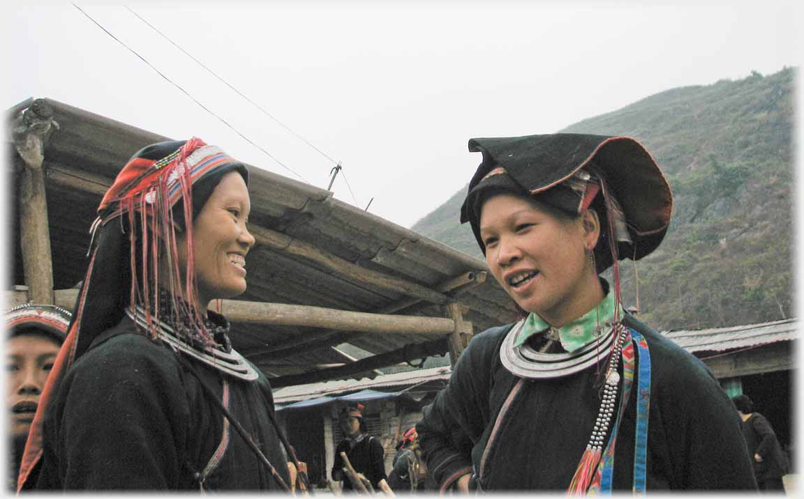 Two women looking at one another.