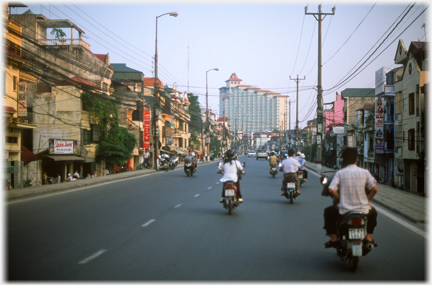 Motorbikes on raised roadway.