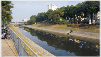 Canal with trees along bank.