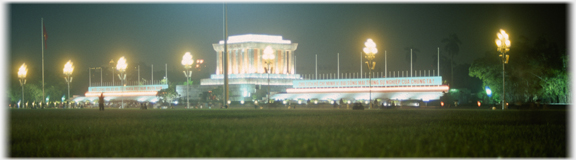 Greek style colinaded floodlite monument with range of lights on either side.