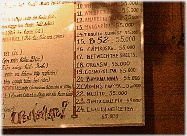 Section of menu on wall.