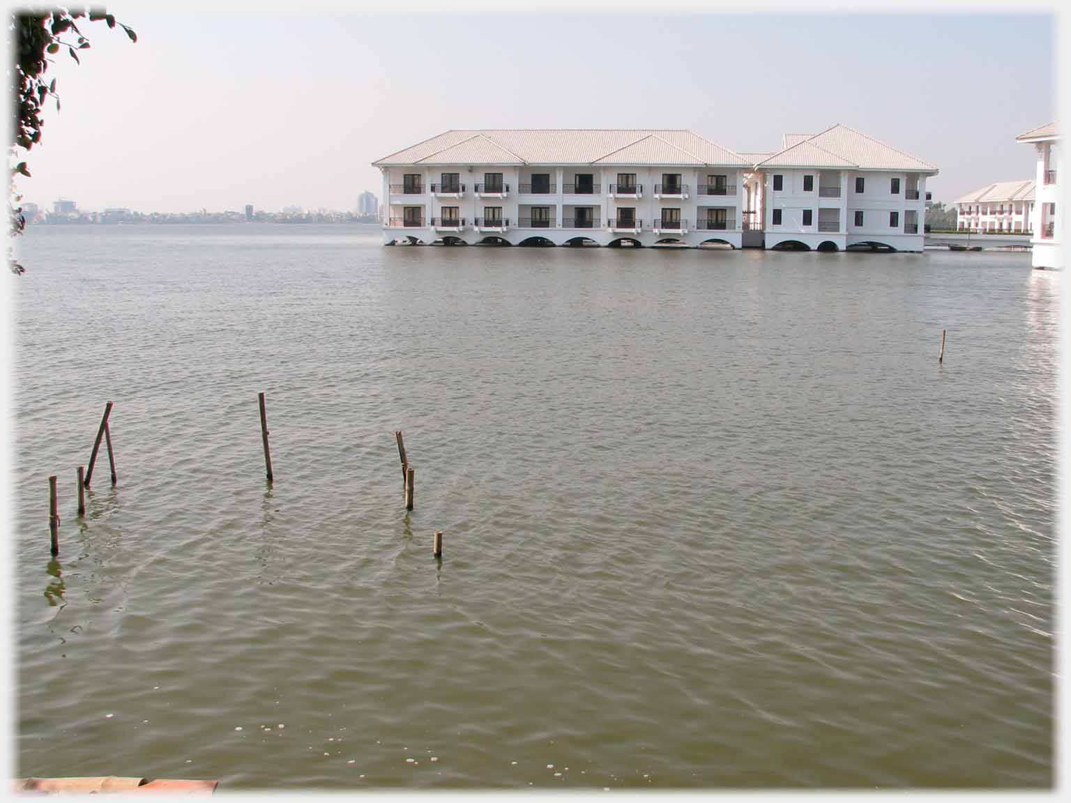 Two story building out into lake.