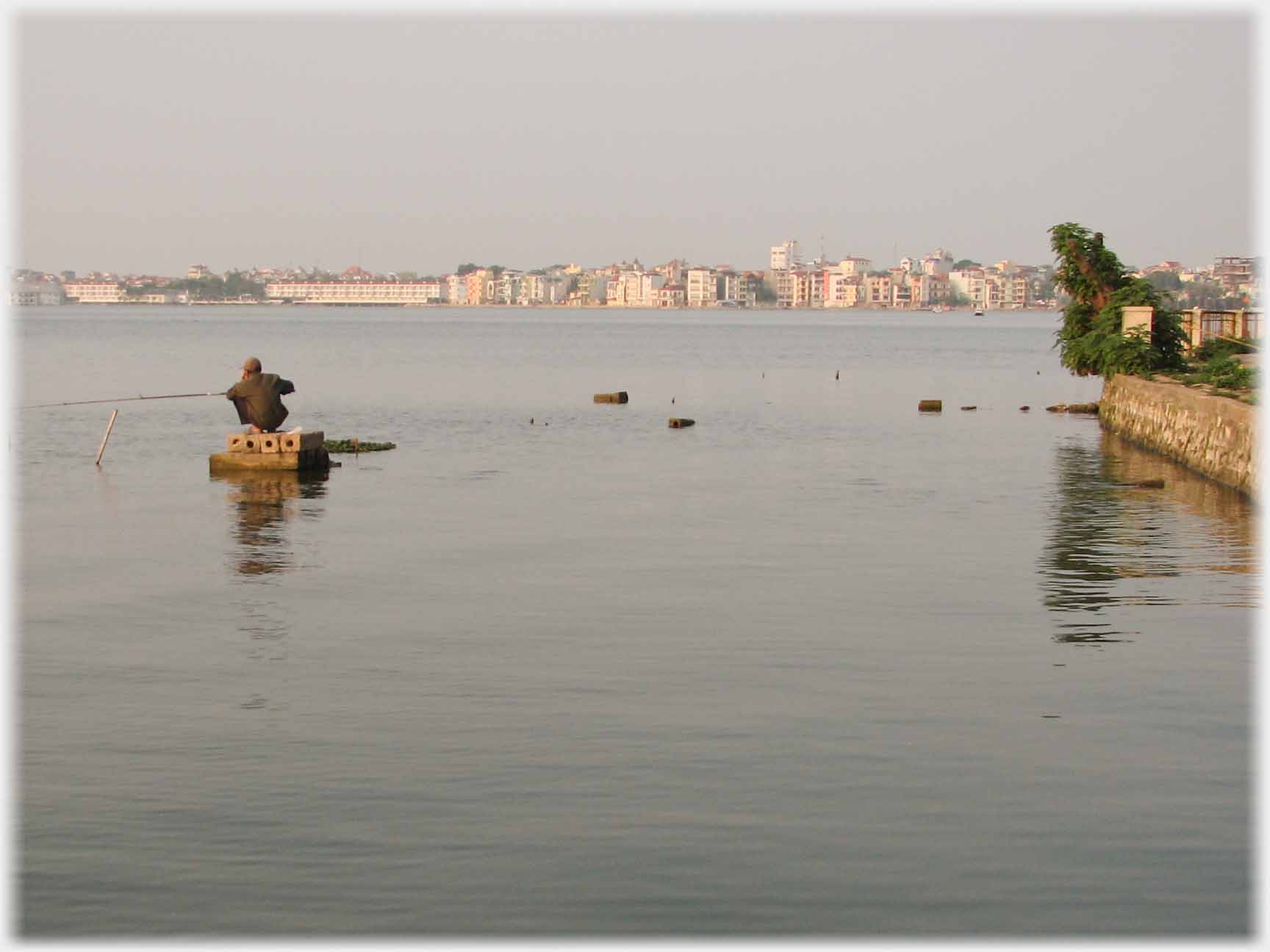 Same man sitting on his blocks witht he view in the other direction - man in next picture.