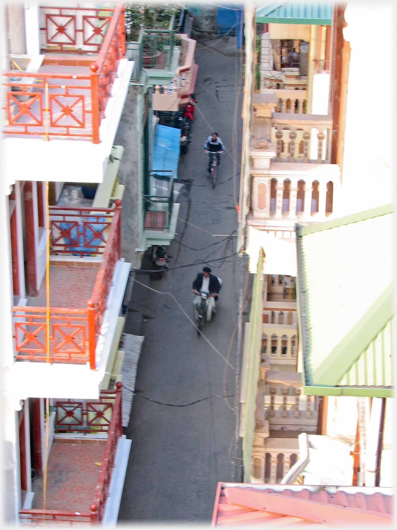 Looking down between balconies to lane.