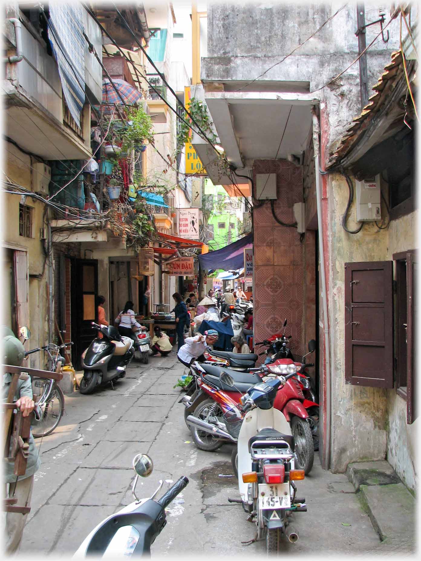 Lane crowded with motorbikes.