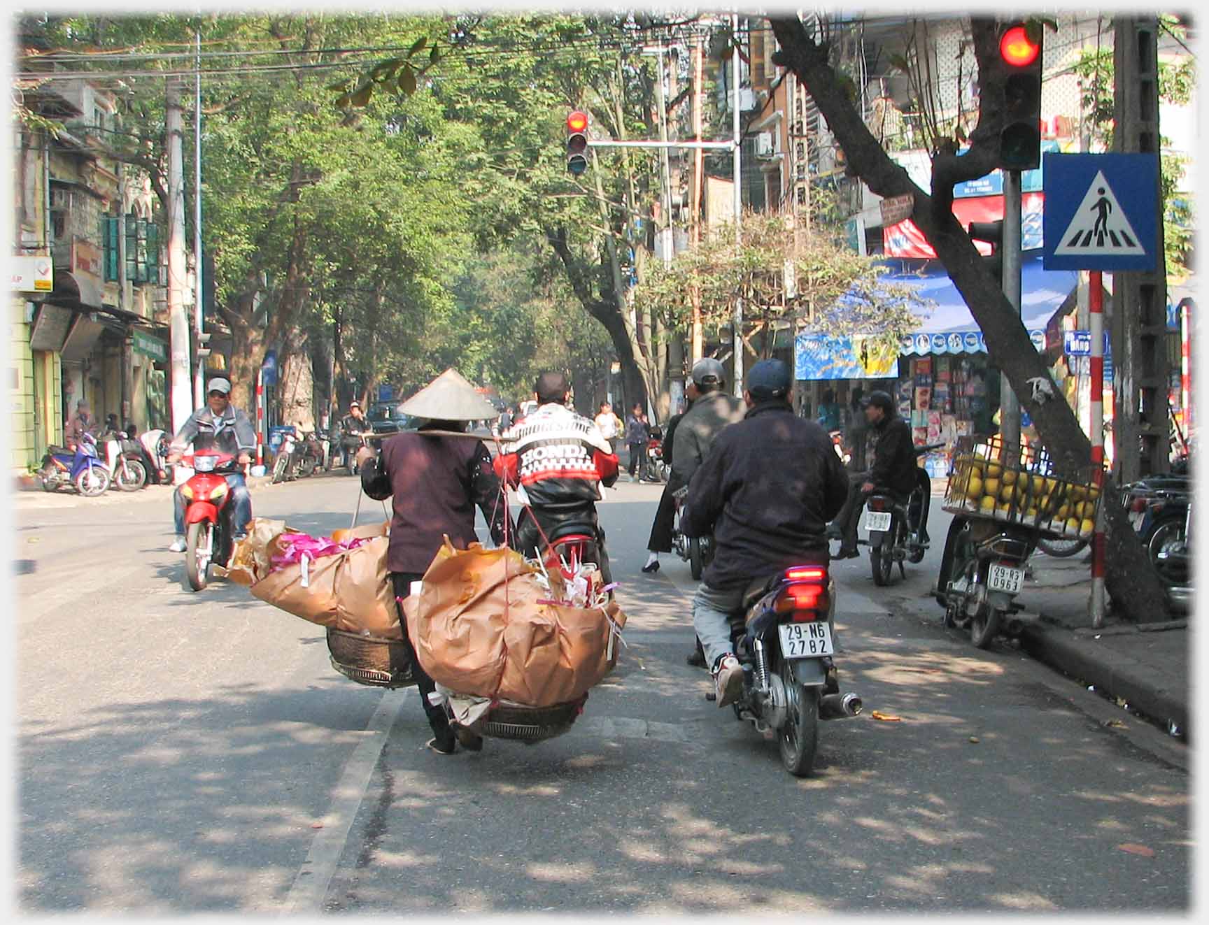 Panniers with large sacks of rubbish.