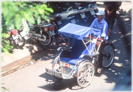 Empty blue rickshaw.