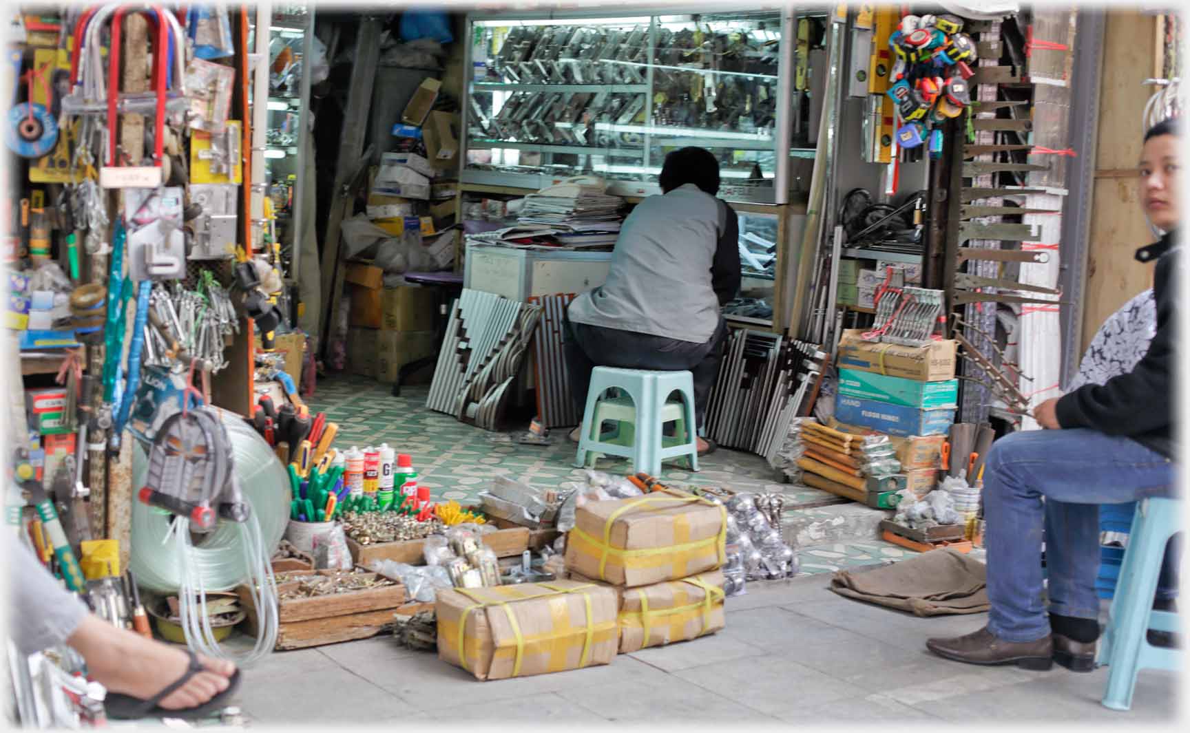 Looking into shop with parcels at entrance.