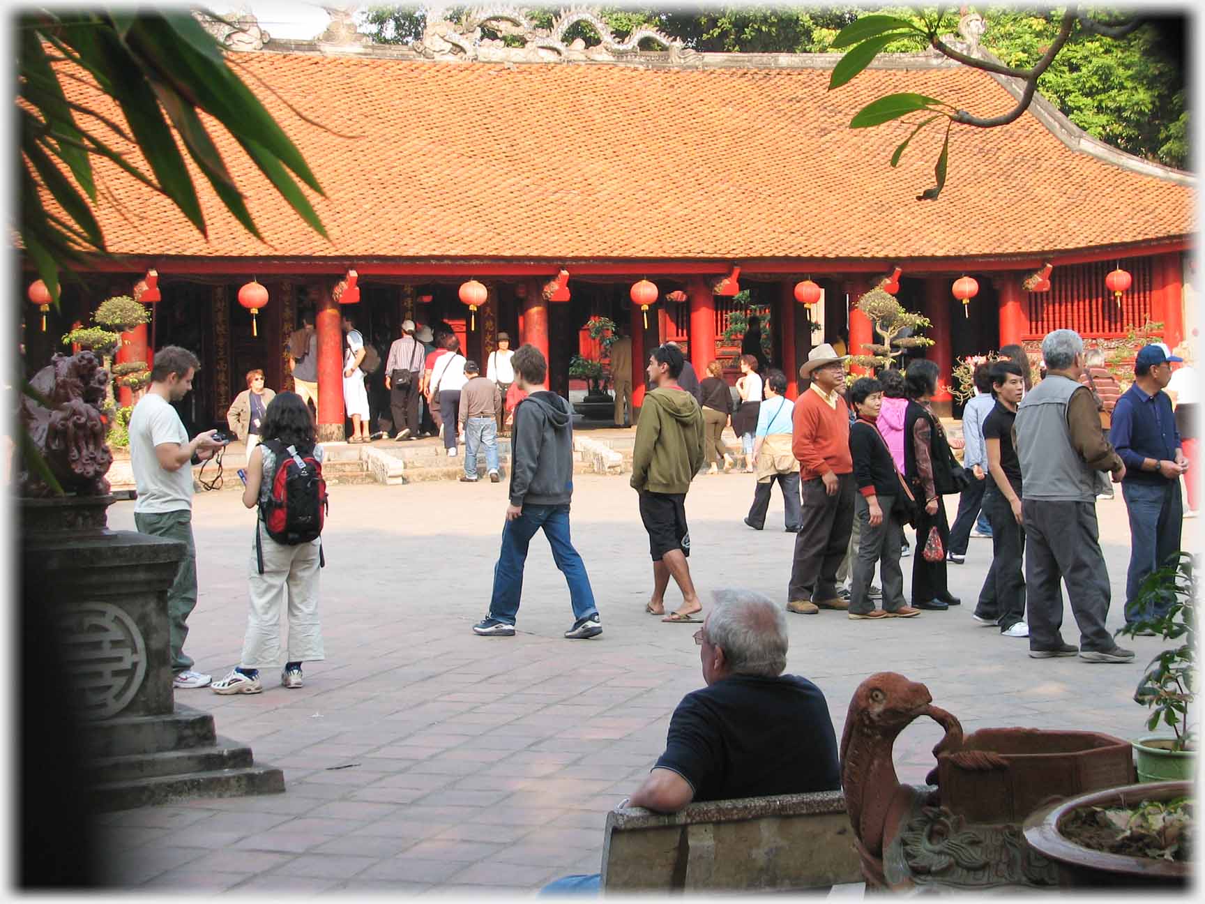 Courtyard with couple dozen people.