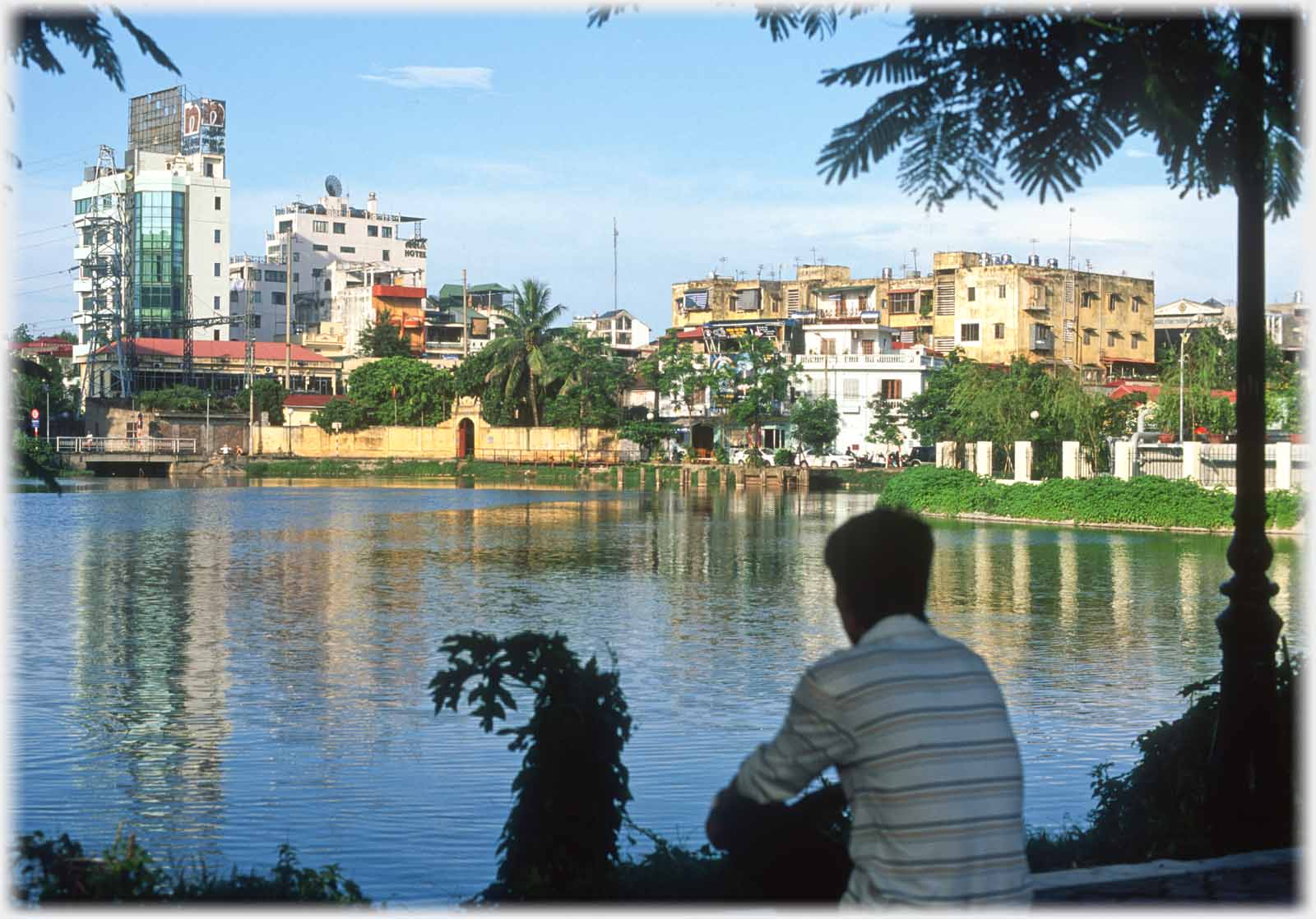 Man - Han - sitting and looking across lake.