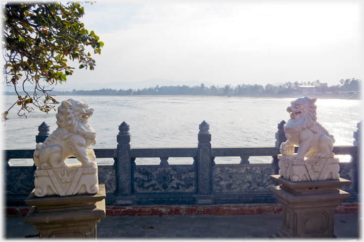 Pair of lions, balustrade and sea beyond.