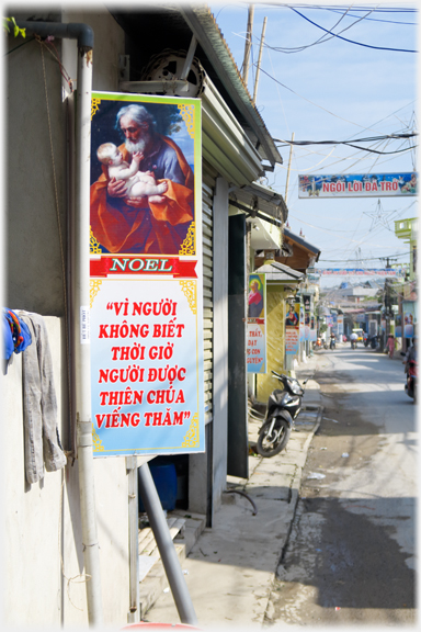 Christian Christmas poster with western man and baby on main street.