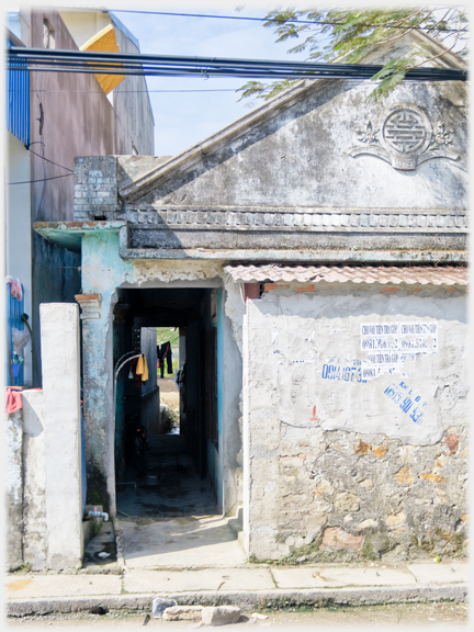 End wall of house and passageway.